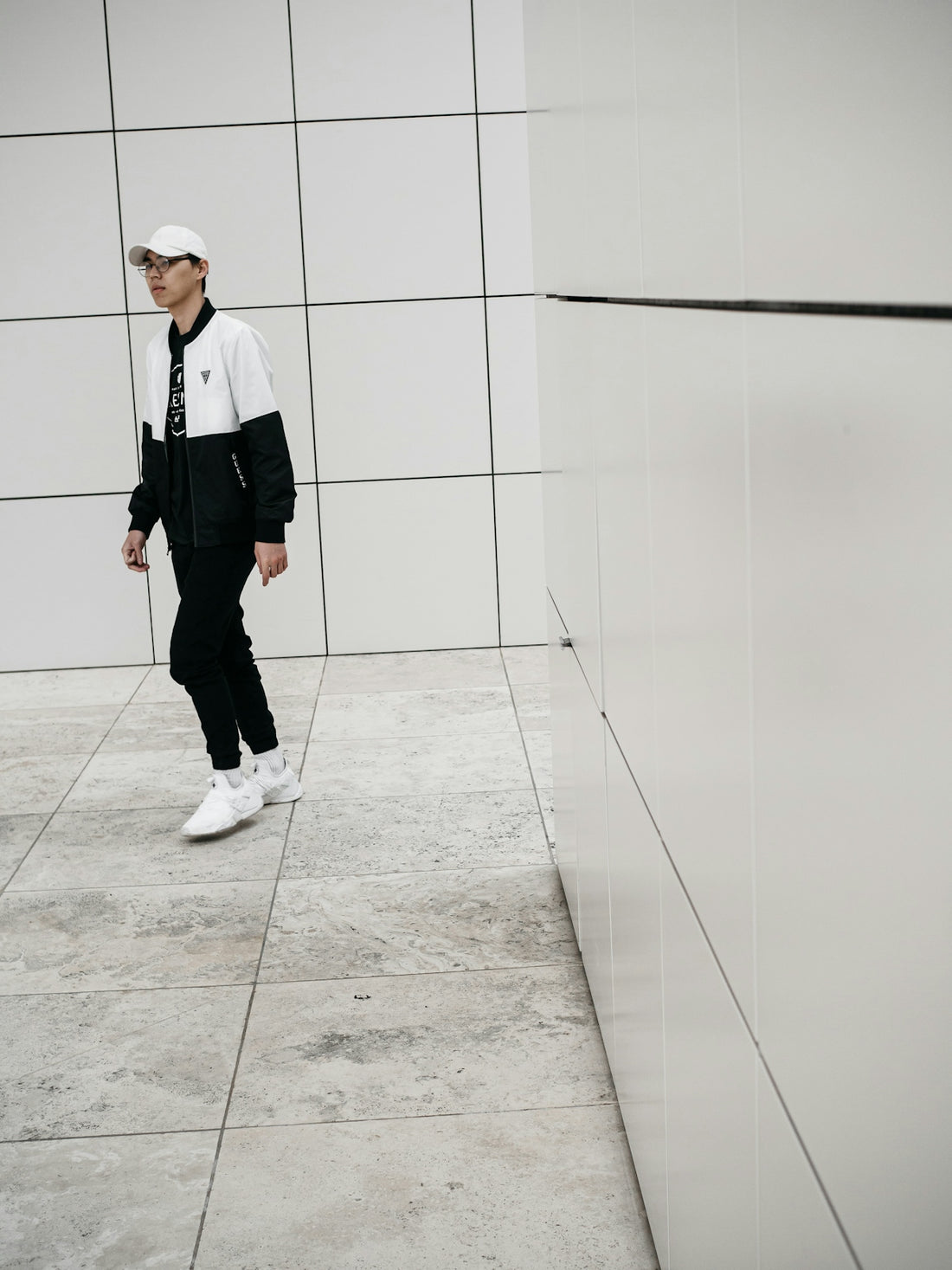 person wearing white and black jacket
