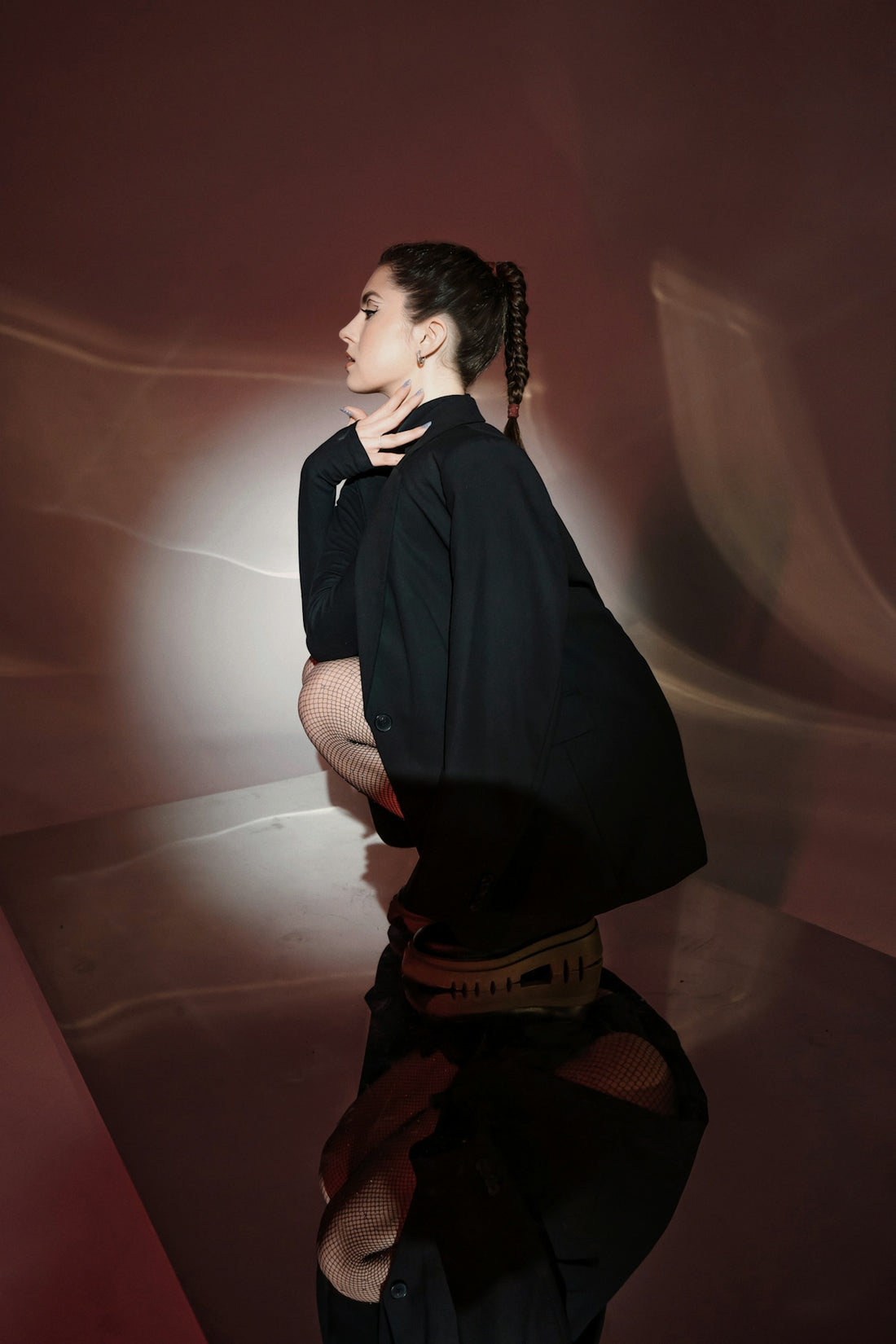 a woman in a black shirt and black pants